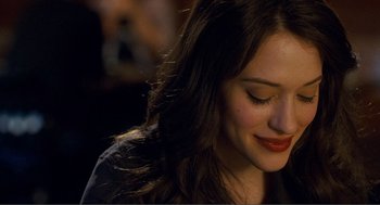 Movie still from “Nick and Norah's Infinite Playlist” (2008), directed by Peter Sollett – A person with long dark hair; Close Up shot, Over the shoulder angle