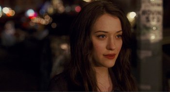 Movie still from “Nick and Norah's Infinite Playlist” (2008), directed by Peter Sollett – A person with long dark hair; Close Up shot, Over the shoulder angle