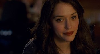 Movie still from “Nick and Norah's Infinite Playlist” (2008), directed by Peter Sollett – A woman's face in a dark room; Close Up shot, Over the shoulder angle