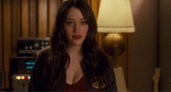 Movie still from “Nick and Norah's Infinite Playlist” (2008), directed by Peter Sollett – A beautiful young woman with long brown hair; Close Up shot, Over the shoulder angle
