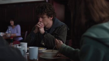 Movie still from “Night Moves” (2013), directed by Kelly Reichardt – A man sitting at a table in front of a bowl of soup; Medium shot, Over the shoulder angle