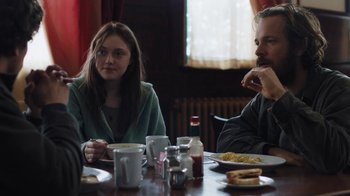 Movie still from “Night Moves” (2013), directed by Kelly Reichardt – A man and a woman sitting at a table eating breakfast; Medium shot, Over the shoulder angle