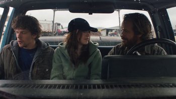 Movie still from “Night Moves” (2013), directed by Kelly Reichardt – Three people sitting in the back seat of a car; Medium shot, Over the shoulder angle