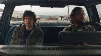 Movie still from “Night Moves” (2013), directed by Kelly Reichardt – Two men sitting in the back seat of a car; Medium shot, Low angle