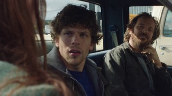 Movie still from “Night Moves” (2013), directed by Kelly Reichardt – Two men sitting in the back seat of a car; Close Up shot, Over the shoulder angle