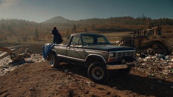 Movie still from “Night Moves” (2013), directed by Kelly Reichardt – An old pick - up truck is parked in the dirt; Extreme Wide shot, High angle