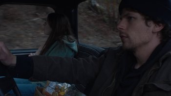 Movie still from “Night Moves” (2013), directed by Kelly Reichardt – A man and a woman in the back seat of a car; Close Up shot, Over the shoulder angle