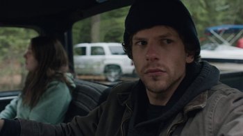 Movie still from “Night Moves” (2013), directed by Kelly Reichardt – A man sitting in the back of a car; Close Up shot, Over the shoulder angle