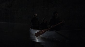 Movie still from “Night Moves” (2013), directed by Kelly Reichardt – Two people are in a canoe in the dark; Wide shot, High angle