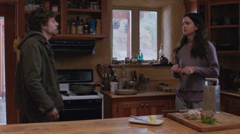 Movie still from “Night Moves” (2013), directed by Kelly Reichardt – A man and a woman standing in a kitchen talking; Medium shot, Over the shoulder angle