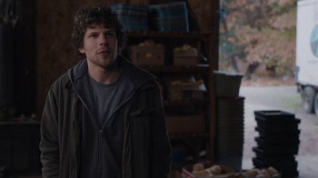 Movie still from “Night Moves” (2013), directed by Kelly Reichardt – A man standing in a room with food on the floor; Medium shot, Over the shoulder angle