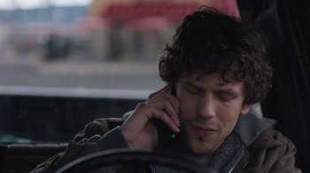 Movie still from “Night Moves” (2013), directed by Kelly Reichardt – A man sitting in a car while talking on a cell phone; Close Up shot, Over the shoulder angle