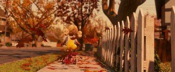 Movie still from “Monster House” (2006), directed by Gil Kenan – A little girl riding a tricycle down a sidewalk; Wide shot, High angle