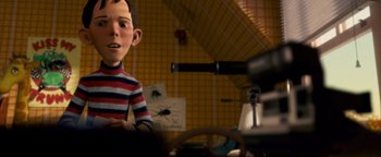 Movie still from “Monster House” (2006), directed by Gil Kenan – A boy is sitting in front of a computer screen; Medium shot, Over the shoulder angle