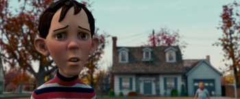 Movie still from “Monster House” (2006), directed by Gil Kenan – The head of a cartoon character in front of a house; Close Up shot, Over the shoulder angle
