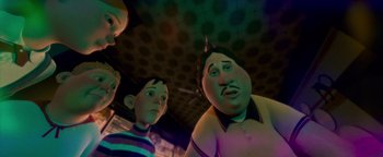 Movie still from “Monster House” (2006), directed by Gil Kenan – A group of people standing next to each other in a room; Medium shot, Low angle