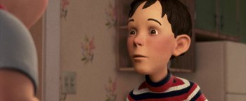 Movie still from “Monster House” (2006), directed by Gil Kenan – A boy with a striped shirt is looking at the camera; Close Up shot, Low angle