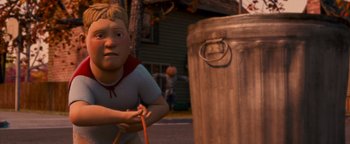 Movie still from “Monster House” (2006), directed by Gil Kenan – A cartoon of a boy holding onto a rope next to a trash can; Medium shot, High angle