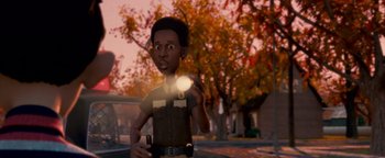 Movie still from “Monster House” (2006), directed by Gil Kenan – A cartoon of a police officer holding a flashlight; Medium shot, Over the shoulder angle