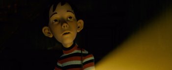 Movie still from “Monster House” (2006), directed by Gil Kenan – A boy's face in the dark; Close Up shot, Low angle