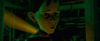 Movie still from “Monster House” (2006), directed by Gil Kenan – A boy's face in a dark room; Close Up shot, Low angle