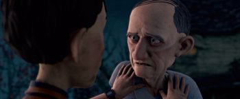 Movie still from “Monster House” (2006), directed by Gil Kenan – An older man looking at a younger man in a mirror; Close Up shot, Over the shoulder angle