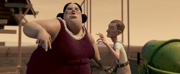 Movie still from “Monster House” (2006), directed by Gil Kenan – An animated woman in a red dress and an animated man; Medium shot, Low angle