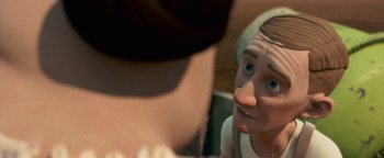 Movie still from “Monster House” (2006), directed by Gil Kenan – A man is looking at another man in the background; Close Up shot, Over the shoulder angle