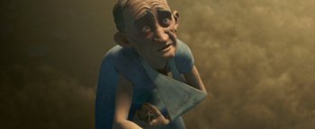 Movie still from “Monster House” (2006), directed by Gil Kenan – An old man holding a piece of cake in his hand; Close Up shot, High angle