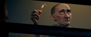 Movie still from “Monster House” (2006), directed by Gil Kenan – A man holding a lit cigarette in front of a mirror; Close Up shot, Low angle