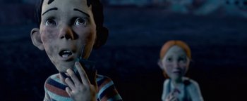 Movie still from “Monster House” (2006), directed by Gil Kenan – A person holding a cell phone in their mouth; Close Up shot, Low angle