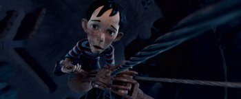Movie still from “Monster House” (2006), directed by Gil Kenan – A young boy holding onto a large metal object; Close Up shot, Low angle