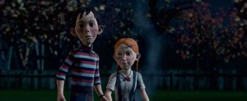 Movie still from “Monster House” (2006), directed by Gil Kenan – A couple of people standing next to each other in the dark; Medium shot, High angle