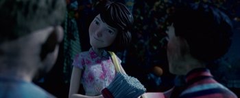 Movie still from “Monster House” (2006), directed by Gil Kenan – A young girl holding a bag of popcorn in her hand; Close Up shot, Over the shoulder angle