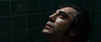 Movie still from “No Country for Old Men” (2007), directed by Joel Coen – A person looking up at the sky; Close Up shot, Low angle