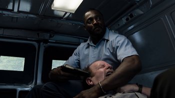 Movie still from “No Good Deed” (2014), directed by Sam Miller – A man with a knife in his hand and another man with a knife in his other's hand; Medium shot, Over the shoulder angle