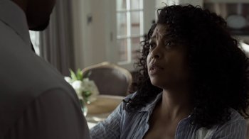 Movie still from “No Good Deed” (2014), directed by Sam Miller – A woman sitting in front of a man in front of a table; Close Up shot, Over the shoulder angle