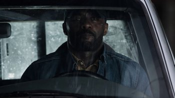 Movie still from “No Good Deed” (2014), directed by Sam Miller – A man sitting in the driver's seat of a car; Close Up shot, Low angle