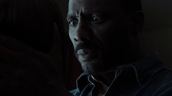 Movie still from “No Good Deed” (2014), directed by Sam Miller – A person with his eyes wide open; Close Up shot, Over the shoulder angle