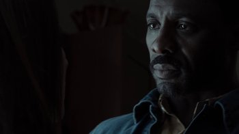 Movie still from “No Good Deed” (2014), directed by Sam Miller – A person wearing a blue shirt; Close Up shot, Over the shoulder angle
