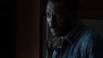 Movie still from “No Good Deed” (2014), directed by Sam Miller – A person wearing a blue shirt; Close Up shot, Over the shoulder angle