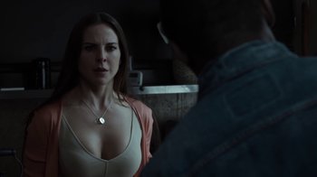 Movie still from “No Good Deed” (2014), directed by Sam Miller – A woman standing next to a man in front of a mirror; Close Up shot, Over the shoulder angle