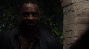 Movie still from “No Good Deed” (2014), directed by Sam Miller – A person wearing a black jacket; Close Up shot, Over the shoulder angle
