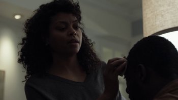 Movie still from “No Good Deed” (2014), directed by Sam Miller – A woman putting makeup on a man's face; Close Up shot, Over the shoulder angle