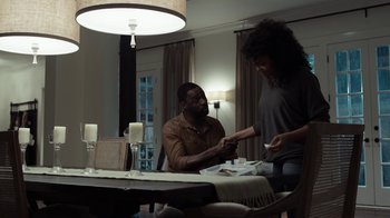 Movie still from “No Good Deed” (2014), directed by Sam Miller – A man and a woman at a dinner table; Medium shot, Over the shoulder angle
