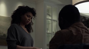 Movie still from “No Good Deed” (2014), directed by Sam Miller – A woman standing next to a man in a living room; Close Up shot, Over the shoulder angle