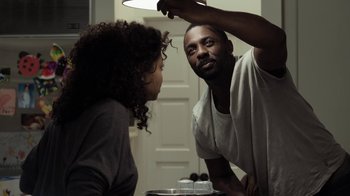 Movie still from “No Good Deed” (2014), directed by Sam Miller – A man and a woman are looking at each other; Medium shot, Over the shoulder angle