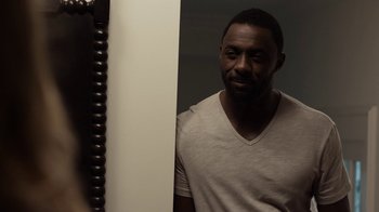 Movie still from “No Good Deed” (2014), directed by Sam Miller – A man standing in front of a mirror looking at himself in the mirror; Close Up shot, Over the shoulder angle