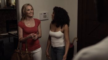 Movie still from “No Good Deed” (2014), directed by Sam Miller – Two women standing next to each other in a room; Medium shot, Over the shoulder angle