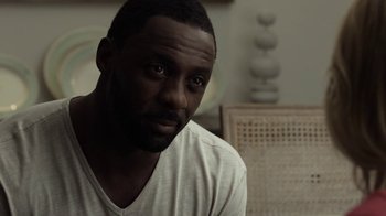 Movie still from “No Good Deed” (2014), directed by Sam Miller – A person wearing a white shirt; Close Up shot, High angle